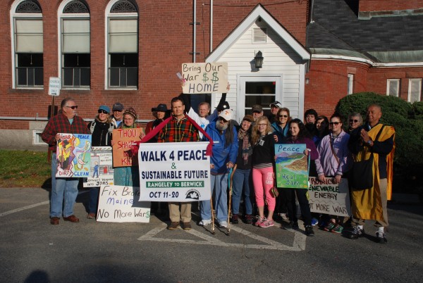 Before starting the walk from the Old South Church in Farmington to Livermore Falls on Tuesday, participants of the Walk For Peace gather for a photo.