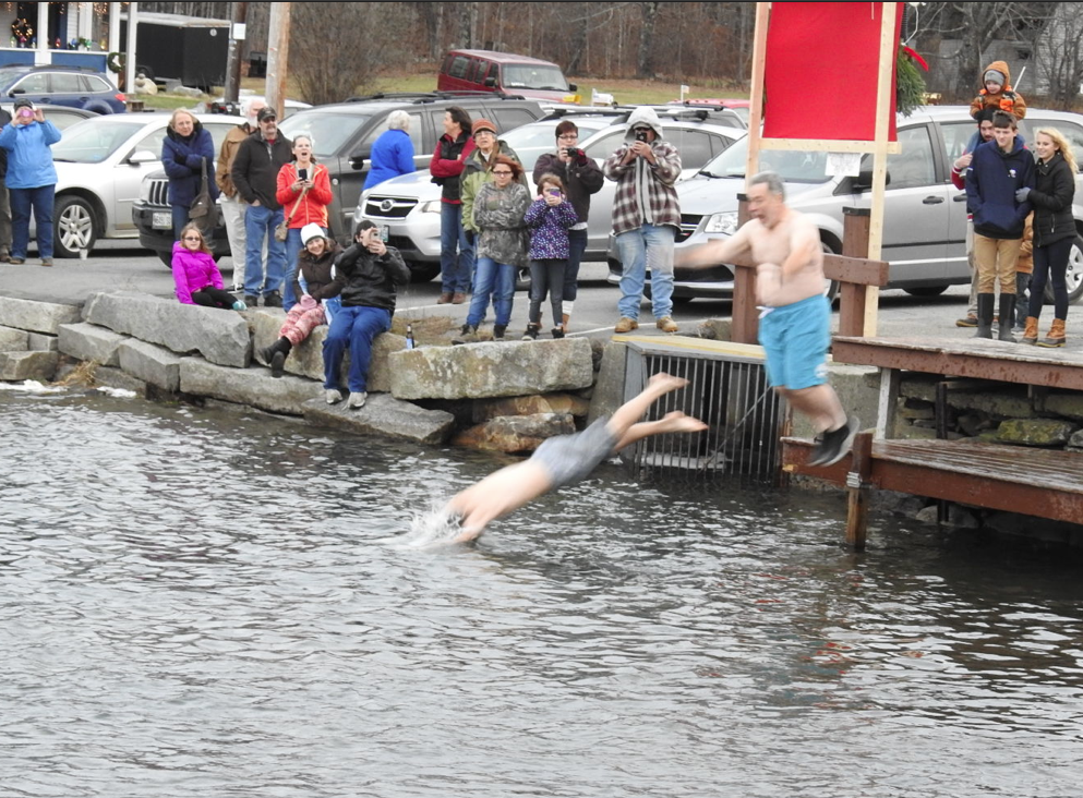 The 35-degree temperature with snow light falling didn't stop these polar bears from taking a swim in Clearwater Lake. The event is held each year on Chester Greenwood Day.